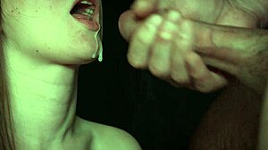 Close-up of amateur brunette giving a blowjob and swallowing cum