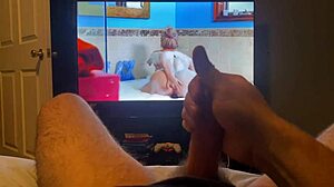 Masturbating to a hot porn video featuring a monster cock